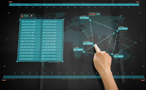 A hand points to a node on a digital map displayed on a screen, highlighting interconnected locations&mdash;ideal for transportation dispatch software. A panel listing data or codes appears on the left, with a subtle world map in the background.