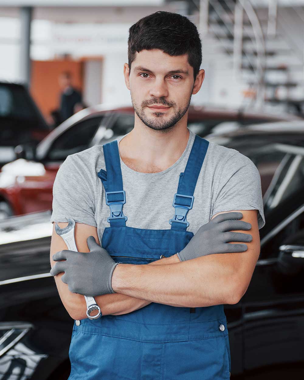 hands of car mechanic with wrench in garage W6C898N